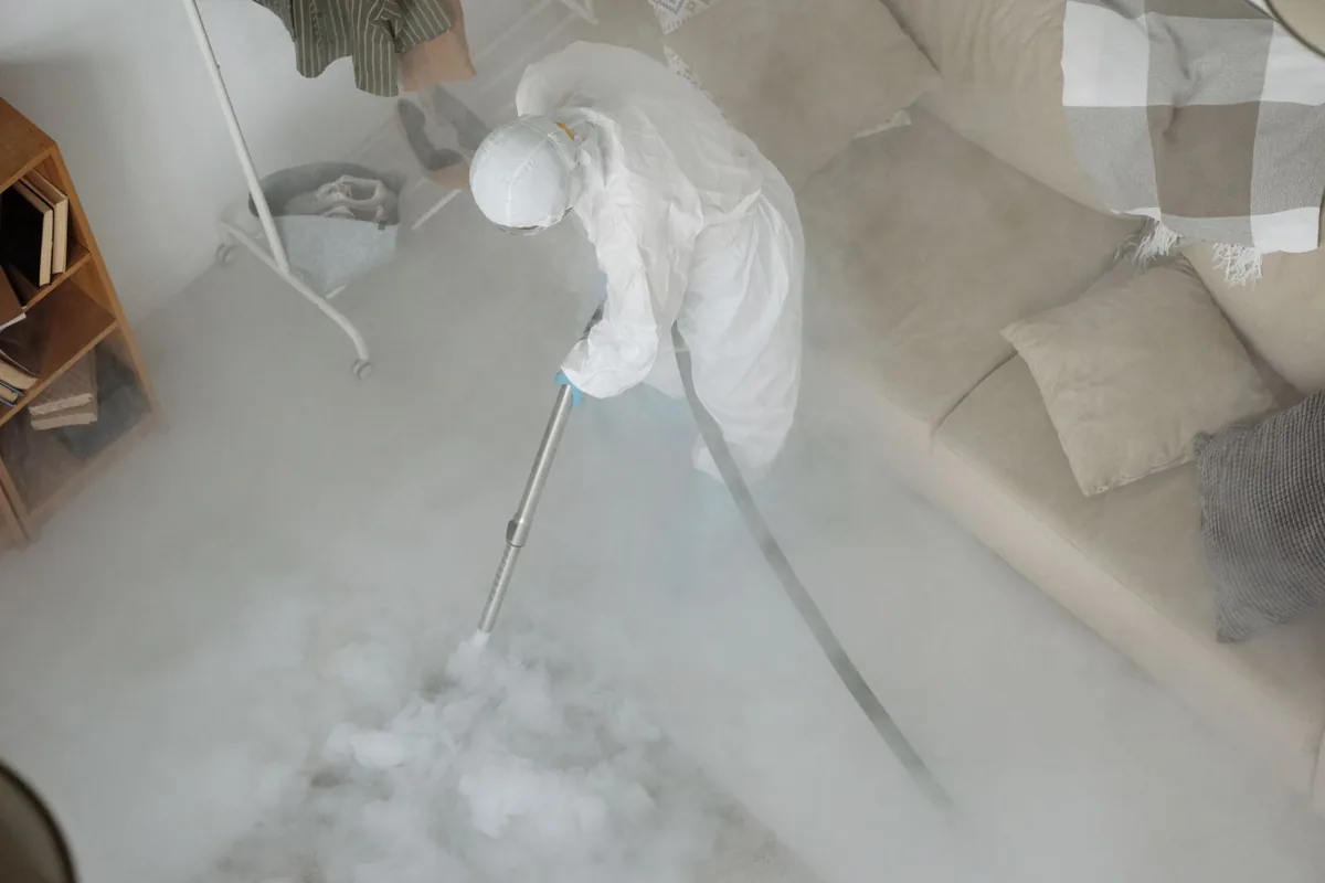 Biohazard cleanup technician in protective equipment, Richmond, CA